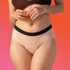 Woman wearing nude cotton panties with black waistband