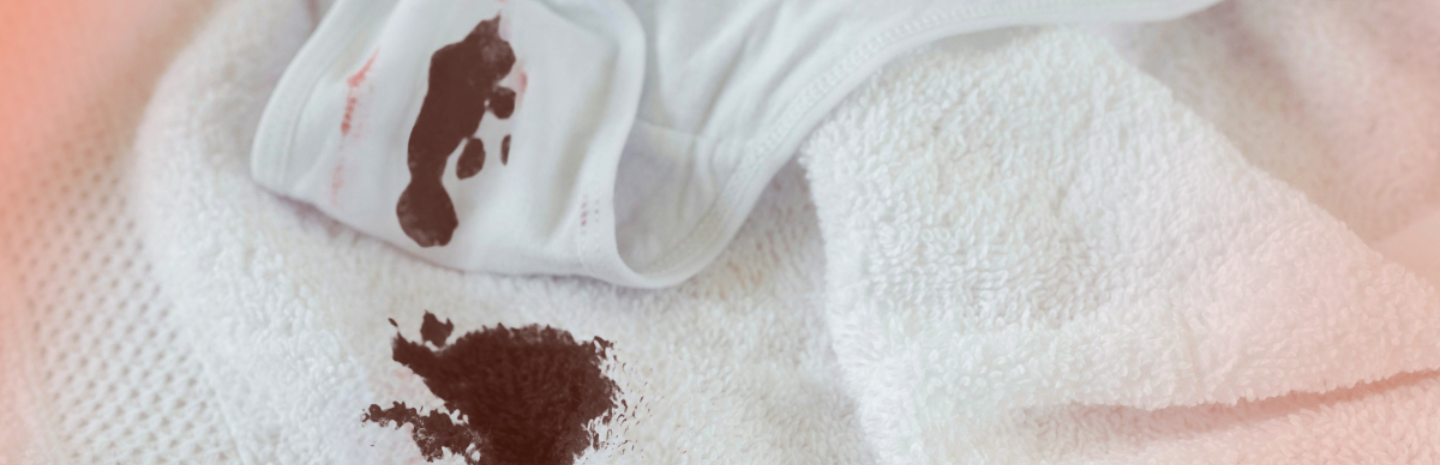 A brown stain is present on white underwear